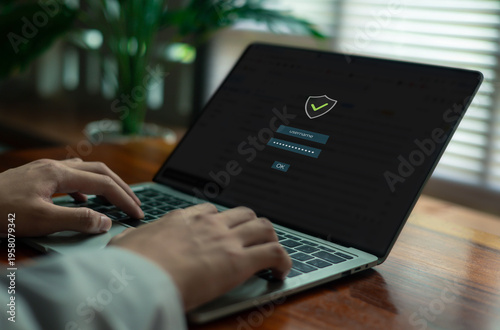 user entering a secure password on a laptop login screen, representing cybersecurity, data protection, user authentication, privacy, and safe digital access in a modern technology environment.