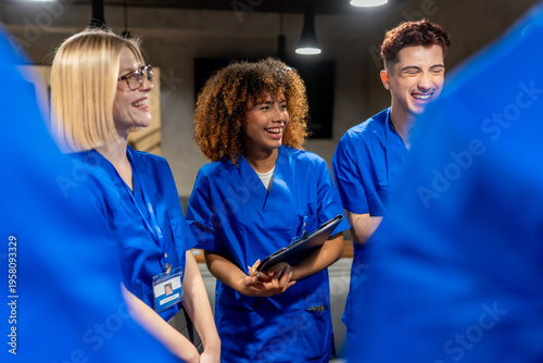 Fotografie Diverse medical students enjoying group discussion and learning