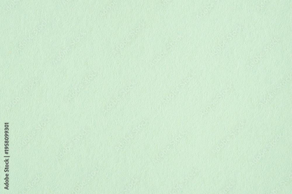 Fototapeta premium Light green paper texture background with soft tone and subtle texture