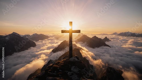 Cross on Mountain Peak above Clouds at Sunset.
