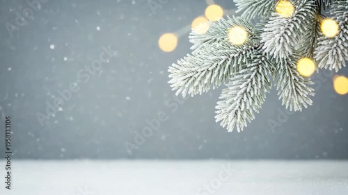 Gentle snowfall and twinkling lights on a frosted fir branch, creating cozy winter holiday atmosphere, soft focus background, subtle motion