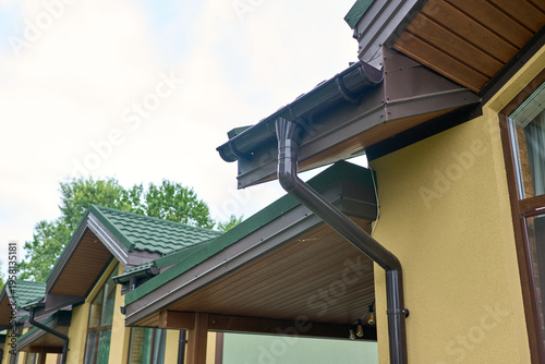 Part of the building cornice and drainage system of the building. semicircular gutter with a drainpipe.