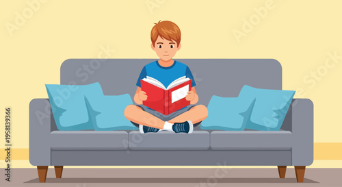Young Boy Reading Book on Sofa 1.
