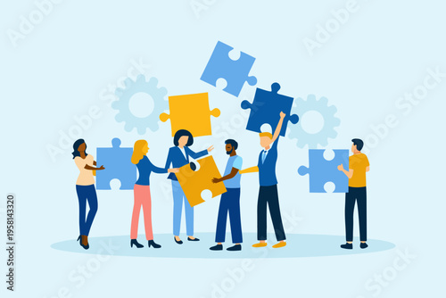 Diverse team collaborating and connecting puzzle pieces for successful teamwork