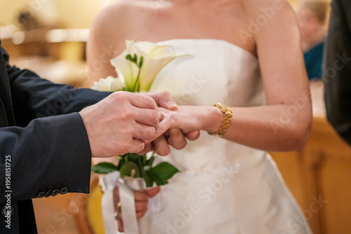 Intimate Wedding With Rings And Flowers. Bride And Groom Celebrate Union During Heartfelt Church Service