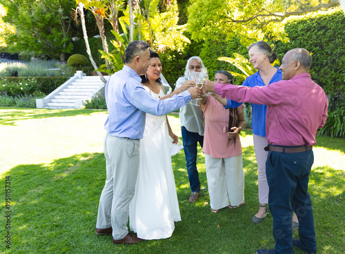 Vertical video: Bride raising flute and starting animated bubbles circling couple for wedding toast