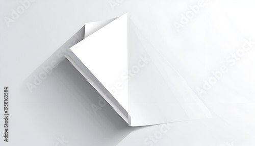 Minimalist white folded paper sheet on bright surface with soft shadows for clean design