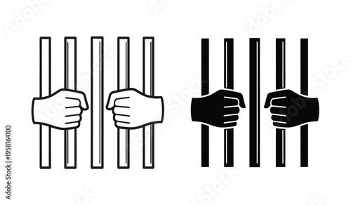 Silhouette of two fists grasping prison bars contrasting black and white