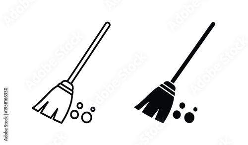Silhouette of two brooms with dust particles cleaning tools in silhouette