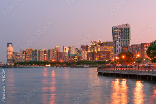 Jersey city skyline with modern condo highrises along Hudson river at twilight, New Jersey, USA