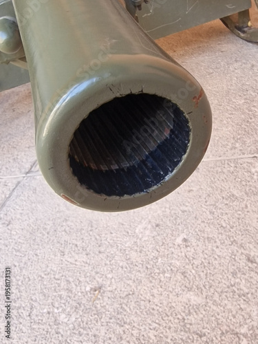 An old cannon from 1935 on large wooden wheels