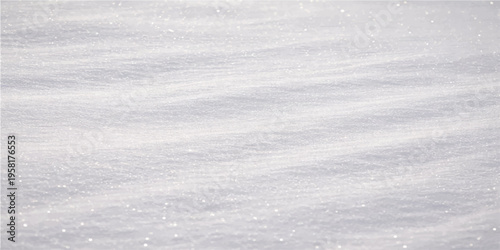 A serene expanse of pristine snow blanketed with soft ripples and delicate textures. The gentle lighting enhances the delicate patterns, creating a sense of calm.