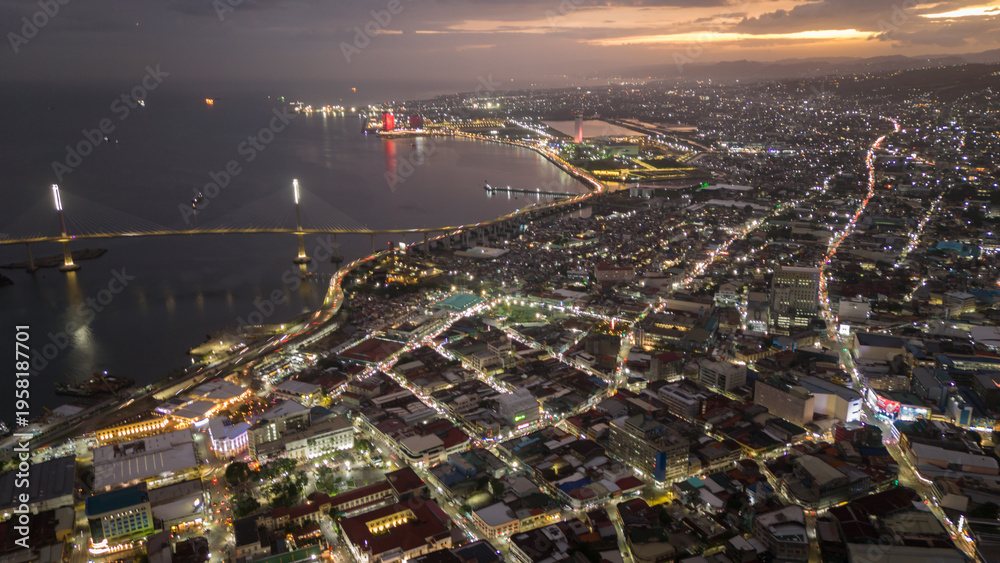Obraz premium aerial view of Cebu City illuminated at night , evening in this major Philippine metropolis skyline cityscape 