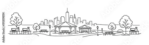 Park pavilion and picnic tables with city skyline in background