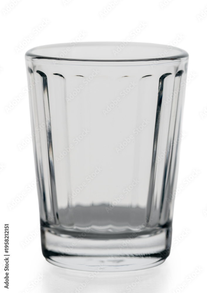 Obraz premium Faceted Crystal Vodka Shot Glass on White Background — Traditional Russian Granyonyi Stopka