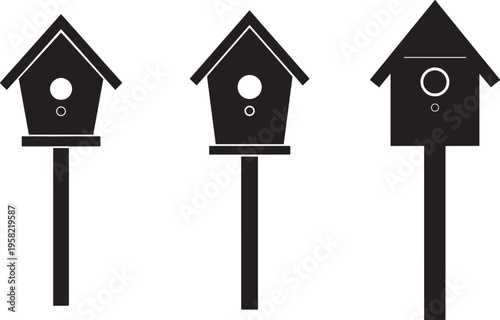 Three black birdhouses on poles with varying roof styles