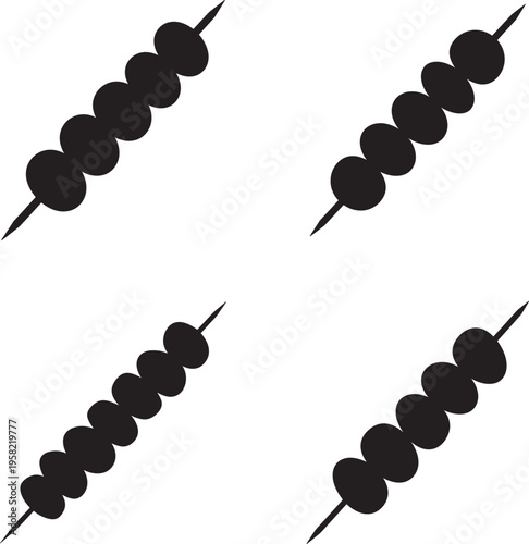 Four black olives on toothpicks arranged in a square