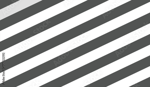 A visually striking diagonal striped pattern in shades of gray and white, creating a dynamic and modern design element