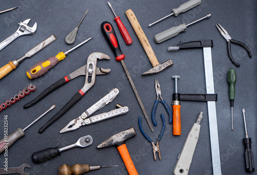 Tablou pe pânză Collection of various hand tools top view hammers screwdrivers pliers, wrenches and clamps