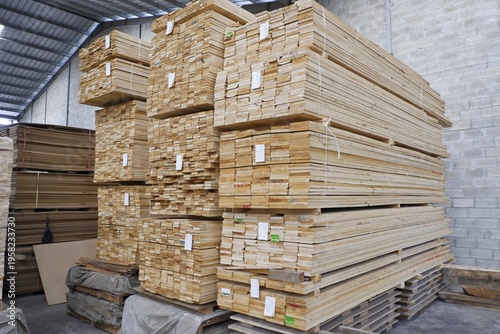 Фотография Large stacks of high-quality plywood boards stored in a professional woodworking