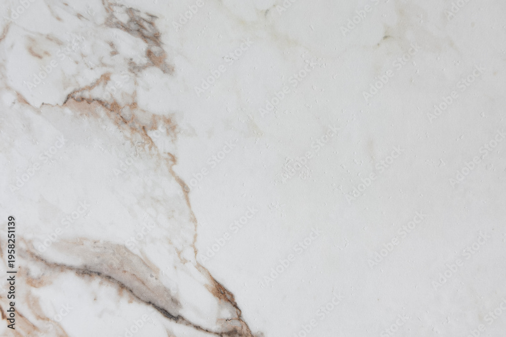 Fototapeta premium Light colored marble surface with subtle brown veins and unique natural patterns and textures