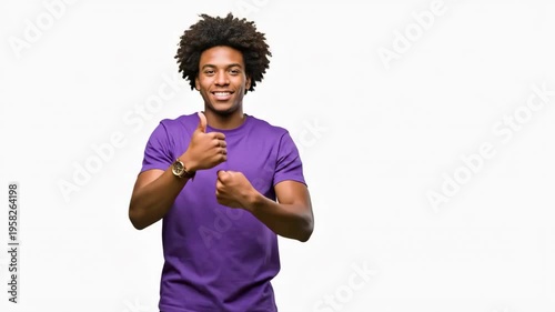 A young man in a purple shirt making a funny face