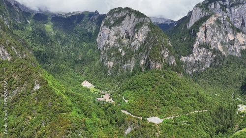 Wallpaper Mural Breathtaking aerial shot of the lush green Balagezong Grand Canyon mountains and a remote Tibetan village nestled in the valley of ShangriLa, Yunnan. Torontodigital.ca