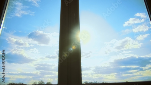 Slika na platnu Sunlight Through Window on Sunny Day with Cloudy Sky, have fun and enjoy