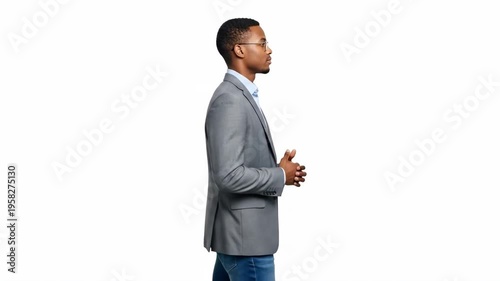 A confident businessman presenting in a modern setting with a professional demeanor
