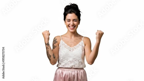 A woman celebrating with excitement and joy in a triumphant moment