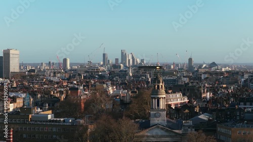 London skyline from St Marylebone area showing historic buildings with London financial district skyscrapers on horizon under a clear sky during daytime