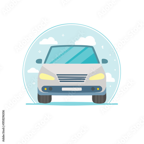 Front view of a modern gray sedan car with headlights on, against a sky background with clouds