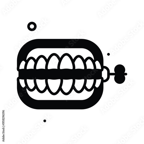 A captivating glyph icon of wind up denture prank toy