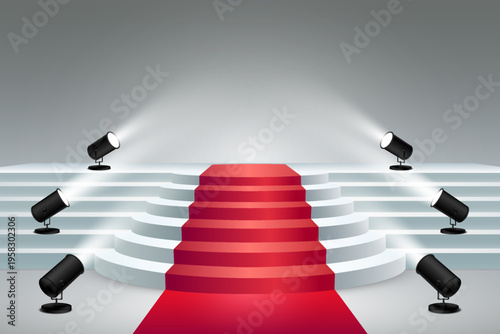 Red carpet leading to illuminated stage with spotlights