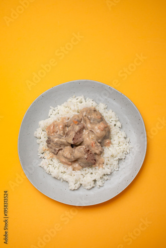 Fried chicken liver with boiled rice on dish