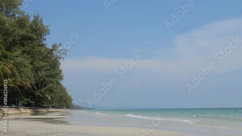 This is Ban Chuen Beach, Trat Province, Thailand. It's a peaceful and beautiful beach, with blue sea water, sandy beaches and a wide area