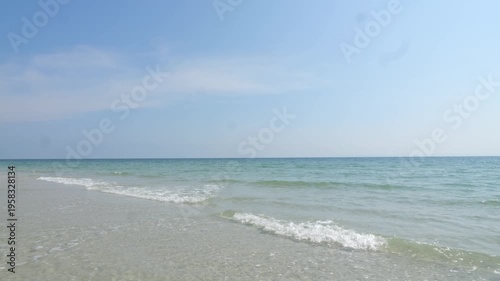 Waves and beautiful sandy beach on a sunny day At Ban Chuen Beach, Trat, Thailand, a beautiful and peaceful beach. It's another unseen Thailand