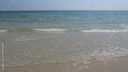Waves crashing on the sand at Ban Chuen Beach, Trat, Thailand, a beautiful and peaceful beach. It's another unseen Thailand