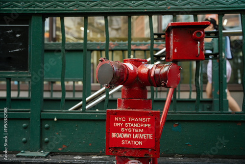 Fotografie A red NYC Transit dry standpipe system stands outside the Broadway Lafayette subway station in New York City