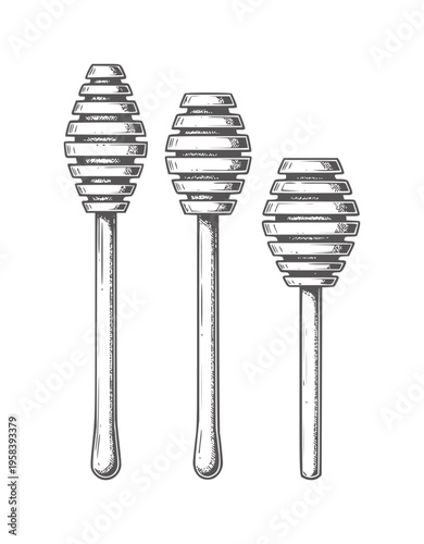 Three honey dippers in a row with grooved heads and long handles stick wood utensil