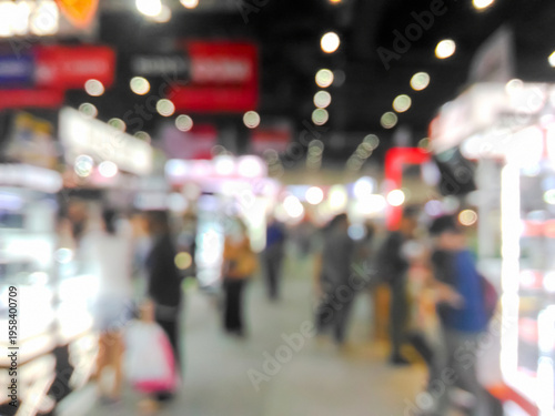 Blurred fair trade and people with colorful bokeh