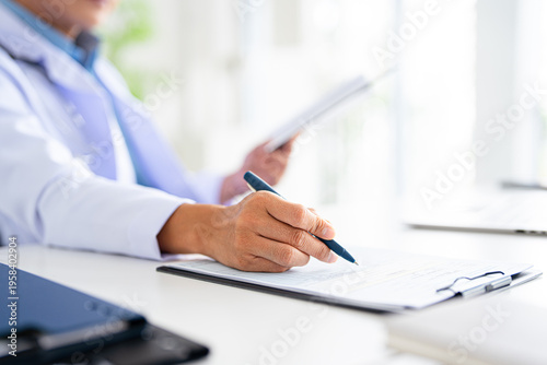 Obraz na plátně closeup Hand Writing, book and notebook by doctor or healthcare professional with a prescription or making notes in an office