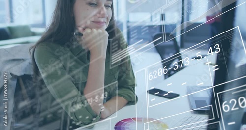 Animation of data processing over caucasian businesswoman in office