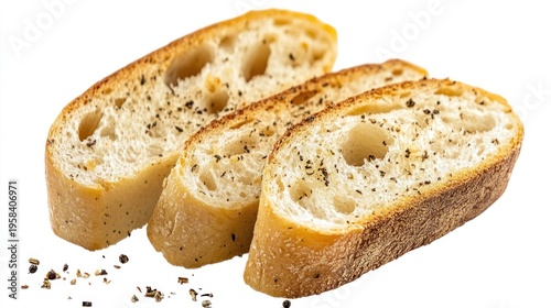Toasted bread slices, sprinkled with pepper, on white background