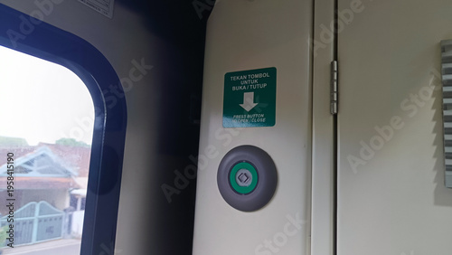 View of the button to open the train carriage door