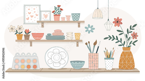 Colorful ceramics art supplies and decorative items on wooden shelves with flowers and framed pictures in a cozy workspace