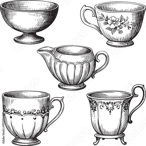 A charming collection of vintage hand drawn tea cups, a sugar bowl, and a creamer jug