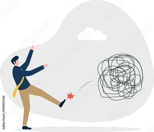 Professional man kicking away a messy tangle representing eliminating confusion
