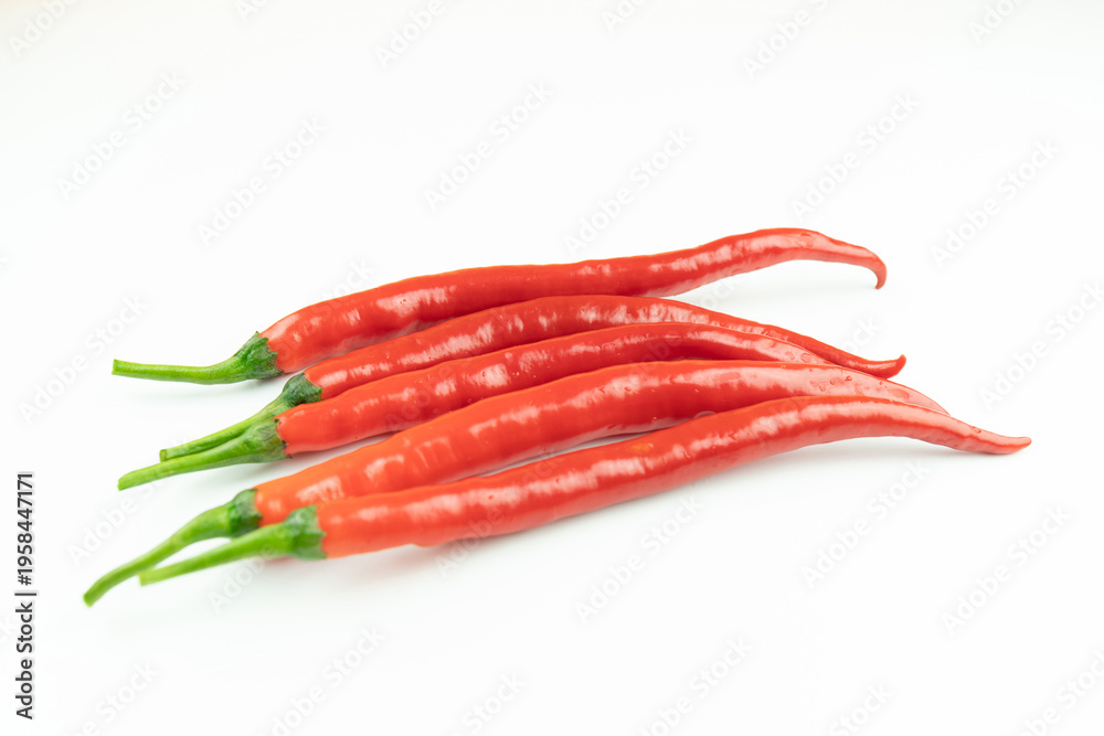 Naklejka premium Fresh red peppers on a white background