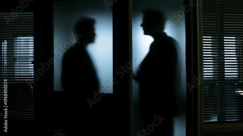 Dim Blue Lighting Amplifies Covert Confrontation Between Business Leaders Behind Glass Walls